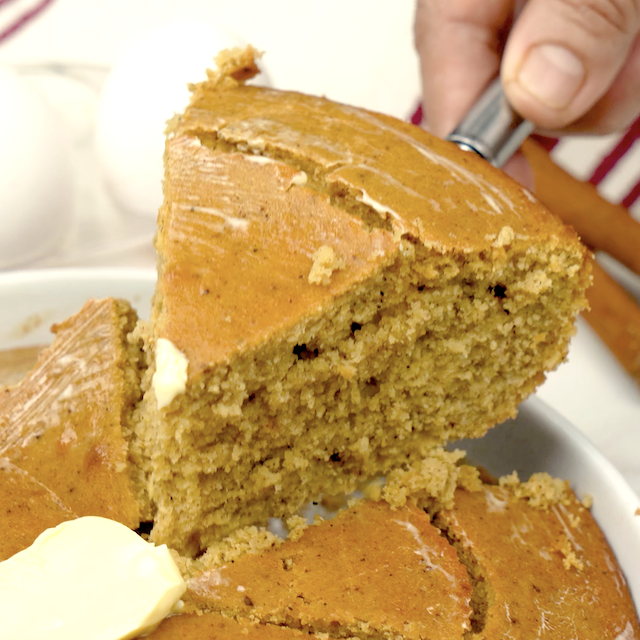 A slice of pumpkin cornbread, ready to be served.