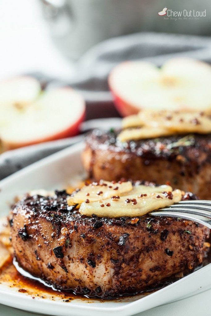 Apple Pork Chops on white plate with fork