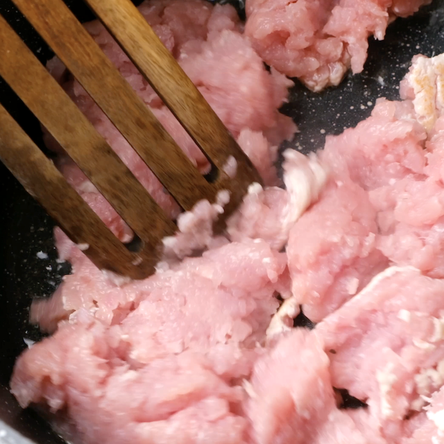 Ground turkey being cooked in a pot to make white bean turkey chili.
