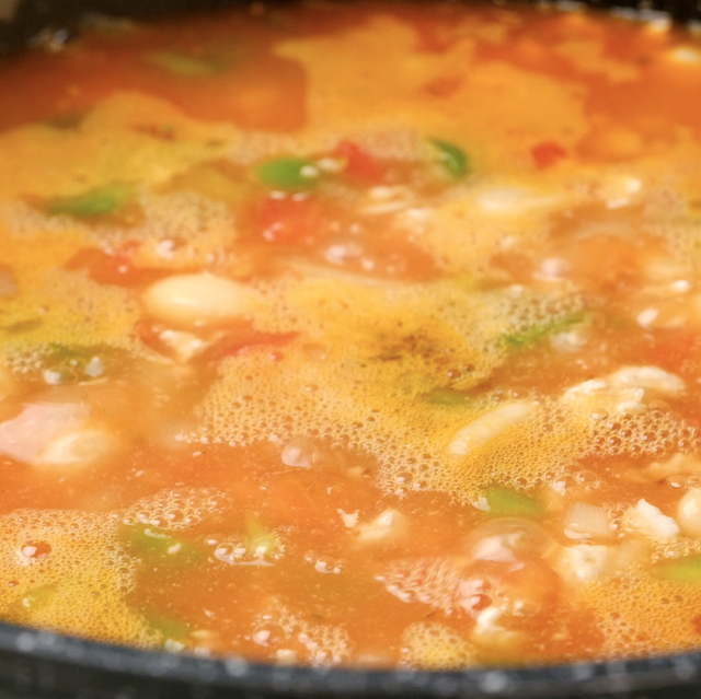 White bean turkey chili simmering in a pot.
