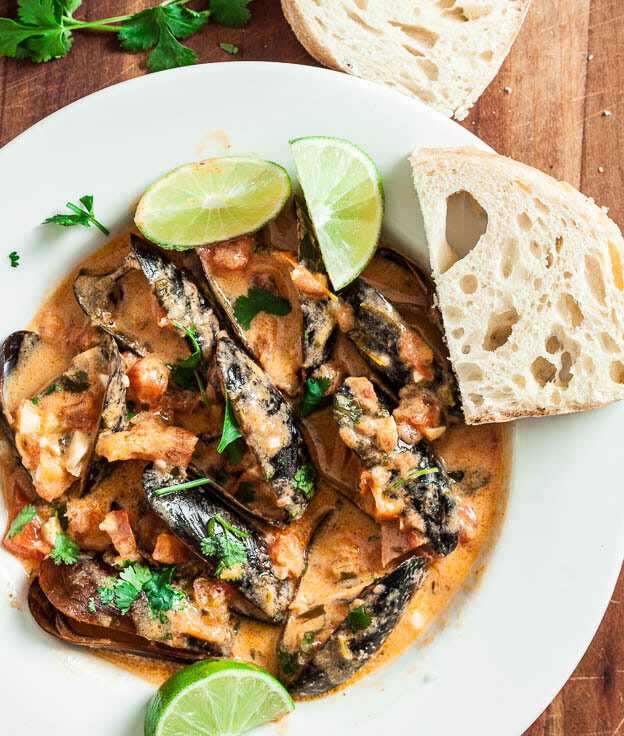 Red Thai Curry Mussels with Lime Wedges and Fresh Cilantro
