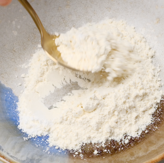 Dry ingredients being mixed together.