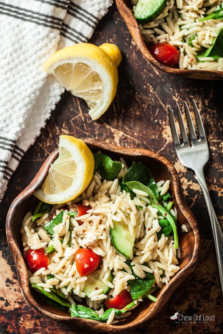 lemon spinach orzo salad in a bowl with fork