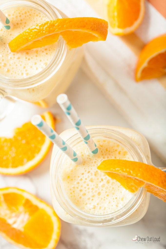 orange smoothies in glasses