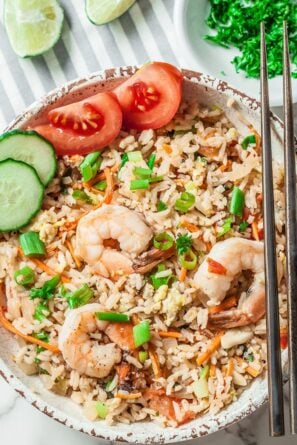 Thai Fried Rice with Shrimp and Sliced Tomato and Cucumber