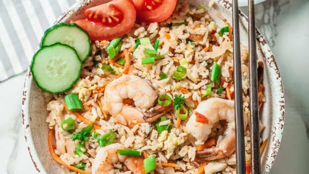 Thai Fried Rice with Shrimp and Sliced Tomato and Cucumber