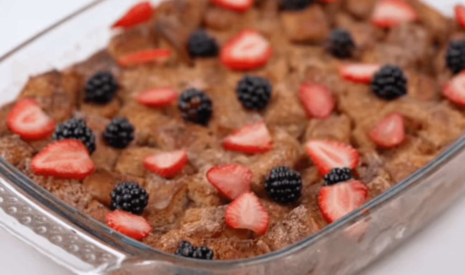 Placing fresh berries on top before serving.
