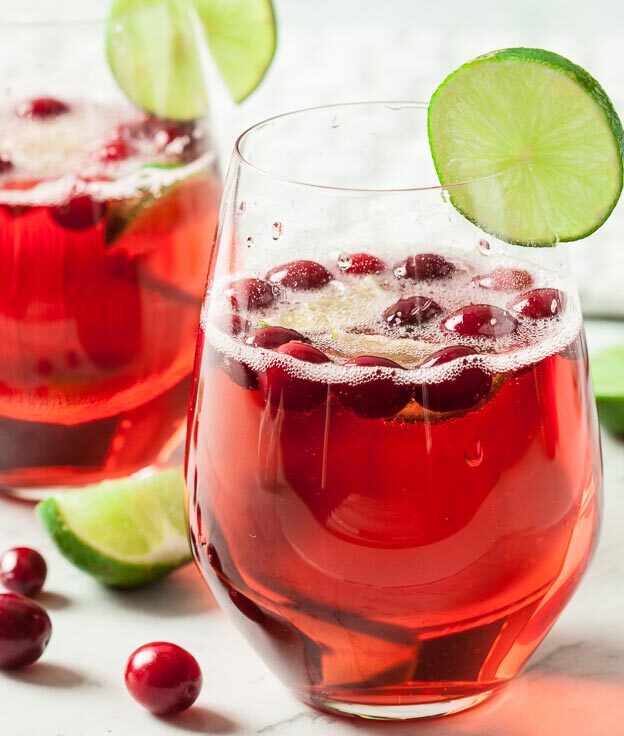 A glass of cranberry prosecco cocktail