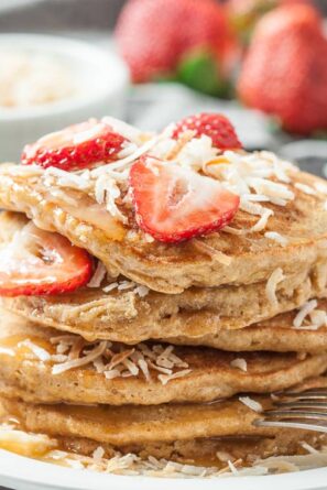 coconut pancakes with strawberries and shredded coconut