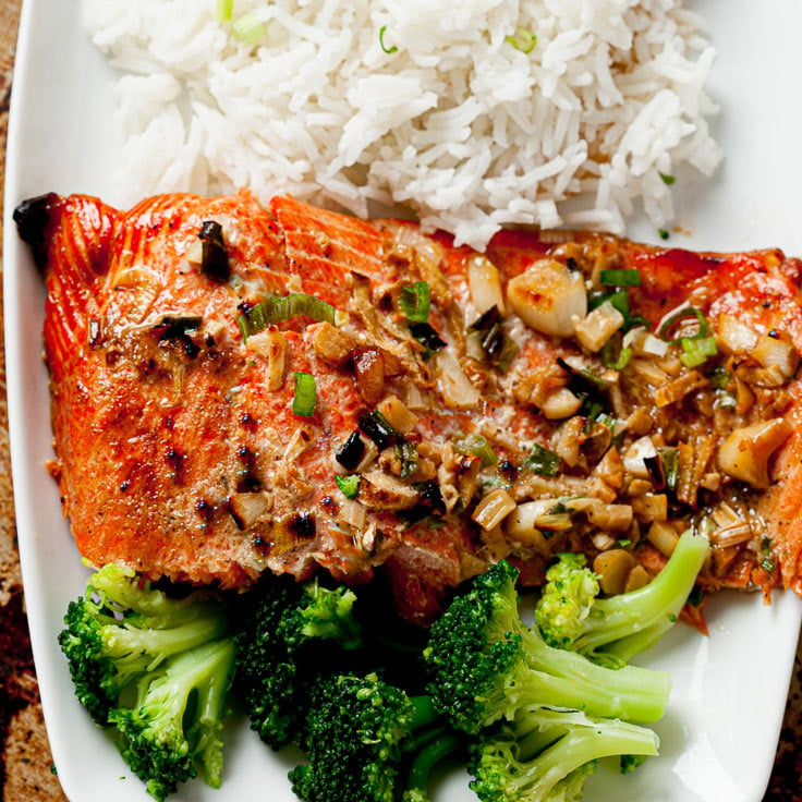 baked salmon with sesame ginger on plate with rice and broccoli