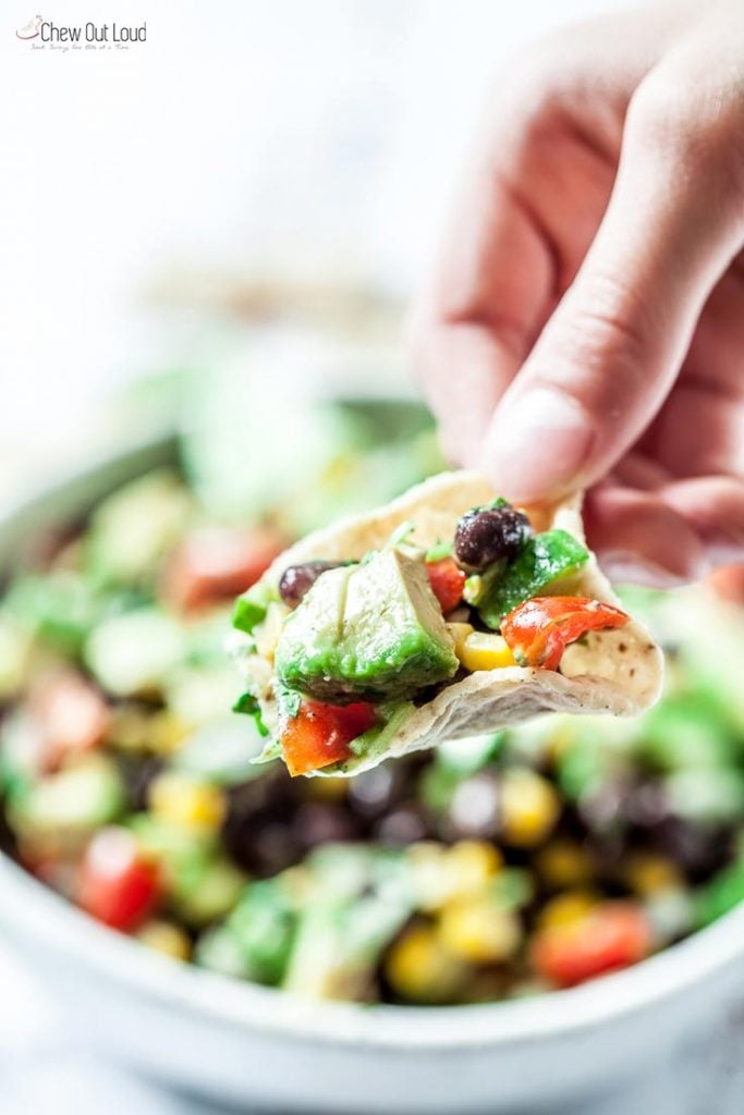 avocado salad with black beans and corn served with tortilla chips