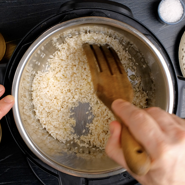 Arborio rice added to butter mixture to make instant pot risotto.