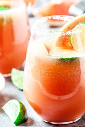 grapefruit paloma cocktail with lime slices in glasses