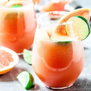grapefruit paloma cocktail with lime slices in glasses