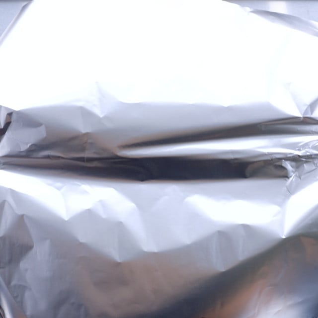 Aluminum foil covering pie pan.
