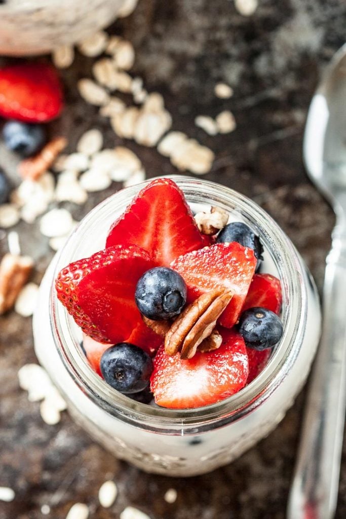 overnight oats recipe in a jar with fresh berries