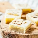 almond dessert bars with slivered almonds on top, cut into squares