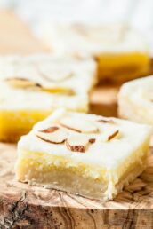 almond dessert bars with slivered almonds on top, cut into squares