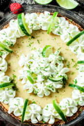 key lime pie with whipped cream and lime slices