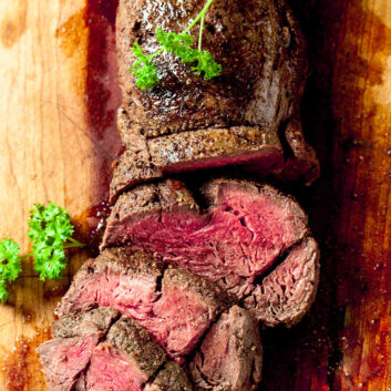 beef tenderloin sliced on a cutting board