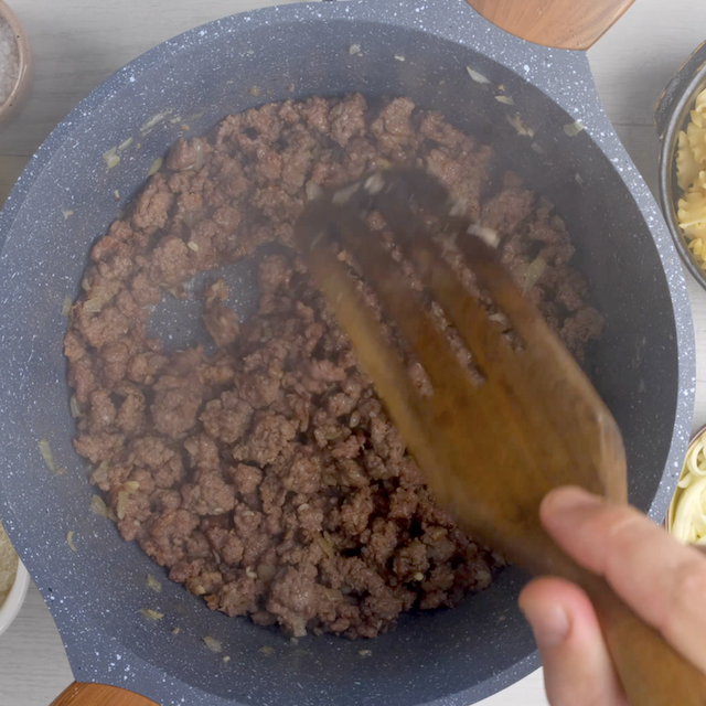 Sausage being browned in a pot to make easy lasagna soup recipe at home.