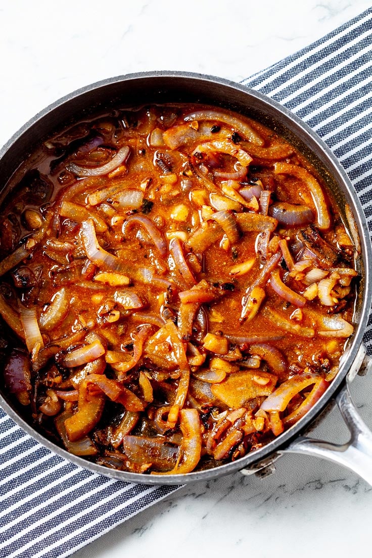 One pan of stirred onion with a sauce