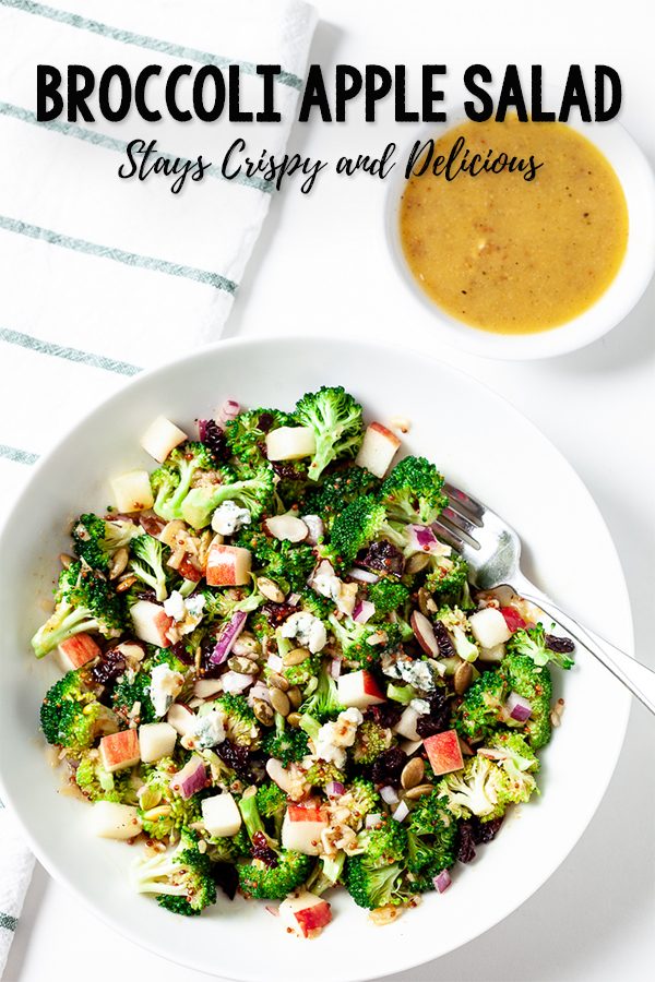 broccoli apple salad in a white bowl with honey mustard dressing