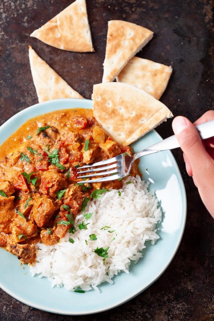 chicken tikka masala with rice and pita bread