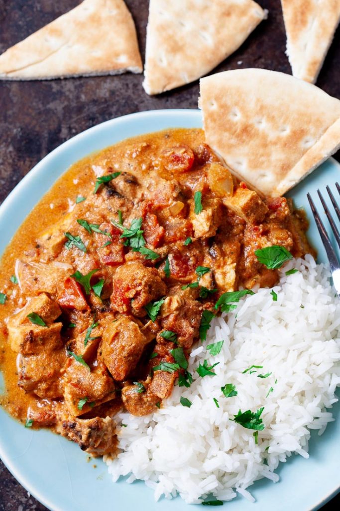 chicken tikka masala with rice and pita bread