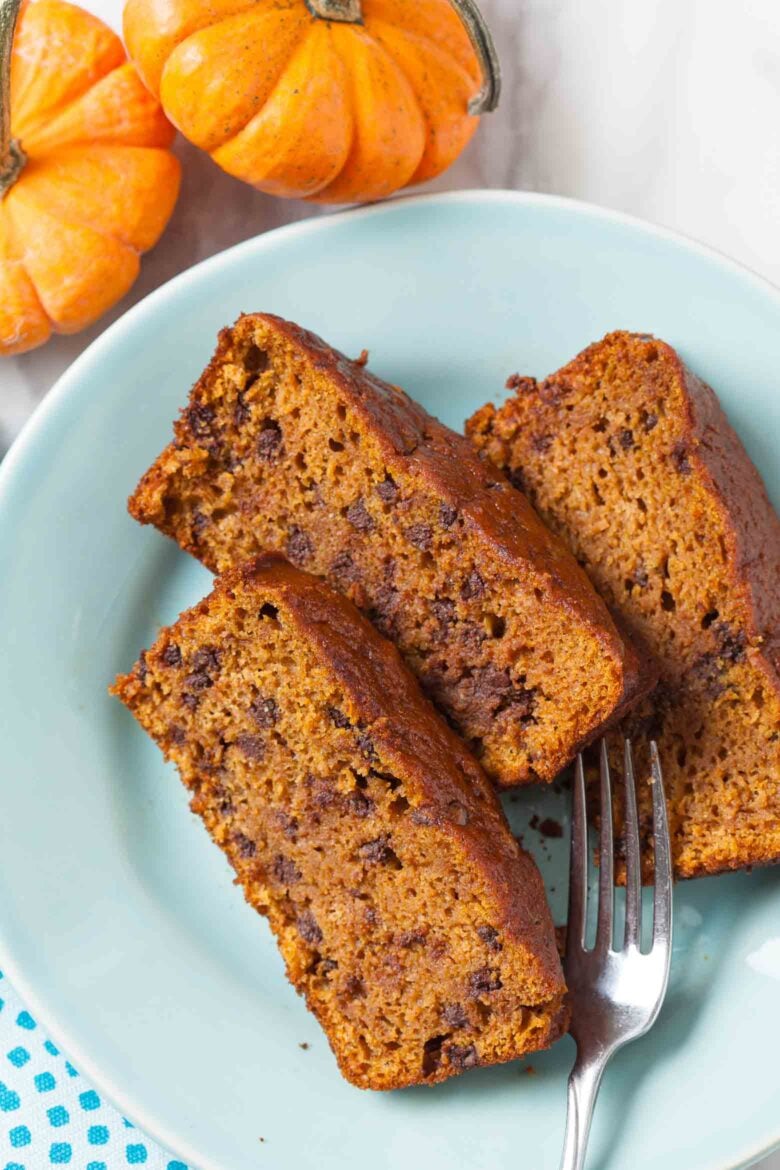 vegan pumpkin bread slices on a turquoise plate. 