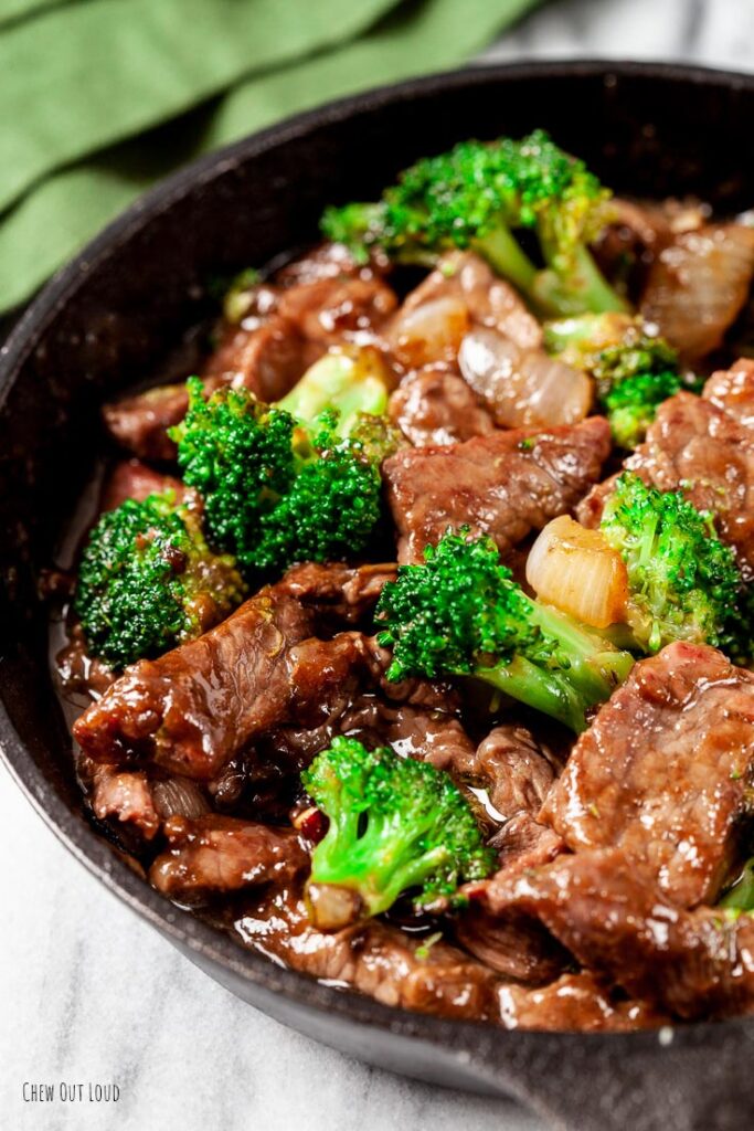 beef and broccoli stir fry in a pan