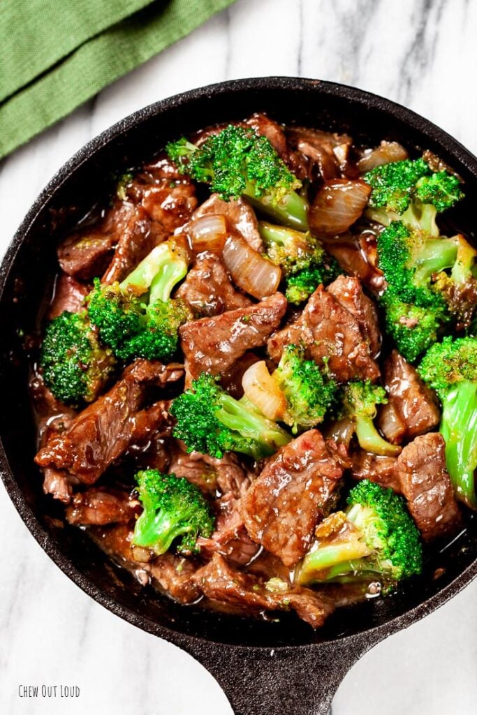 beef and broccoli stir fry in a pan