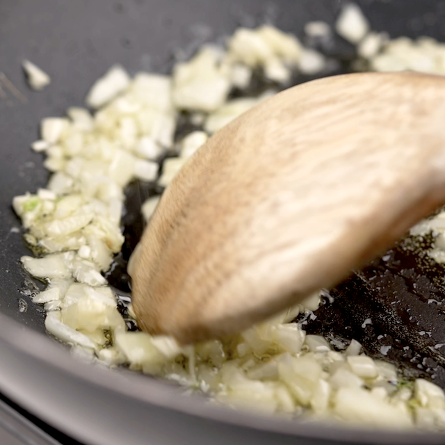 Aromatics being sautéed to make stir fry.