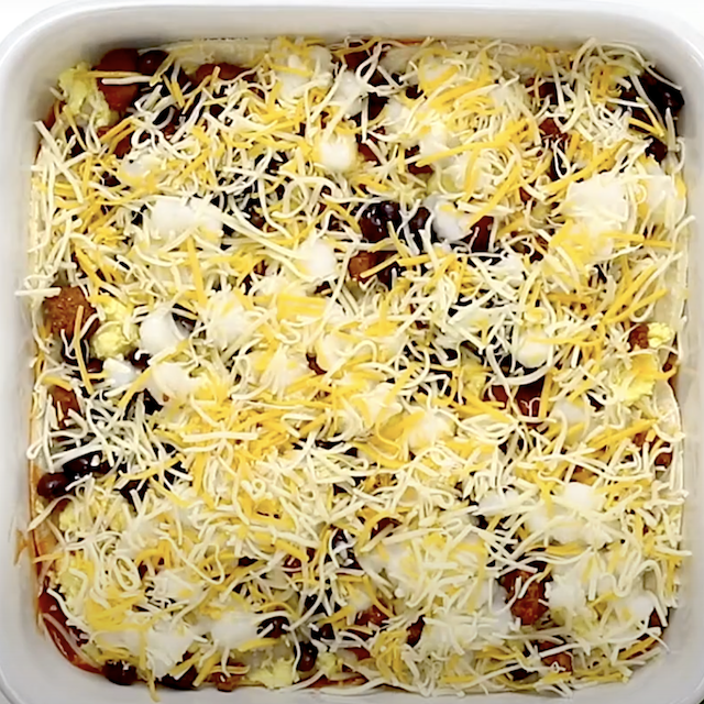 Cheese layered on top to make Mexican breakfast casserole.