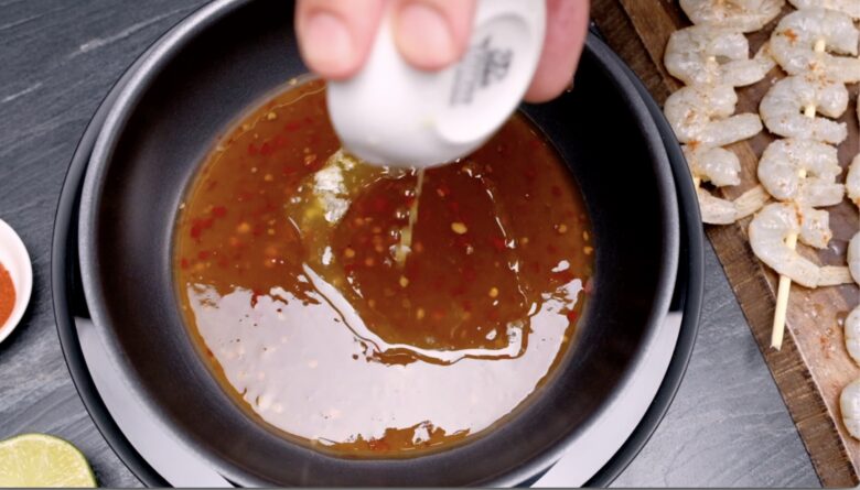 shrimp skewer sauce in a pan
