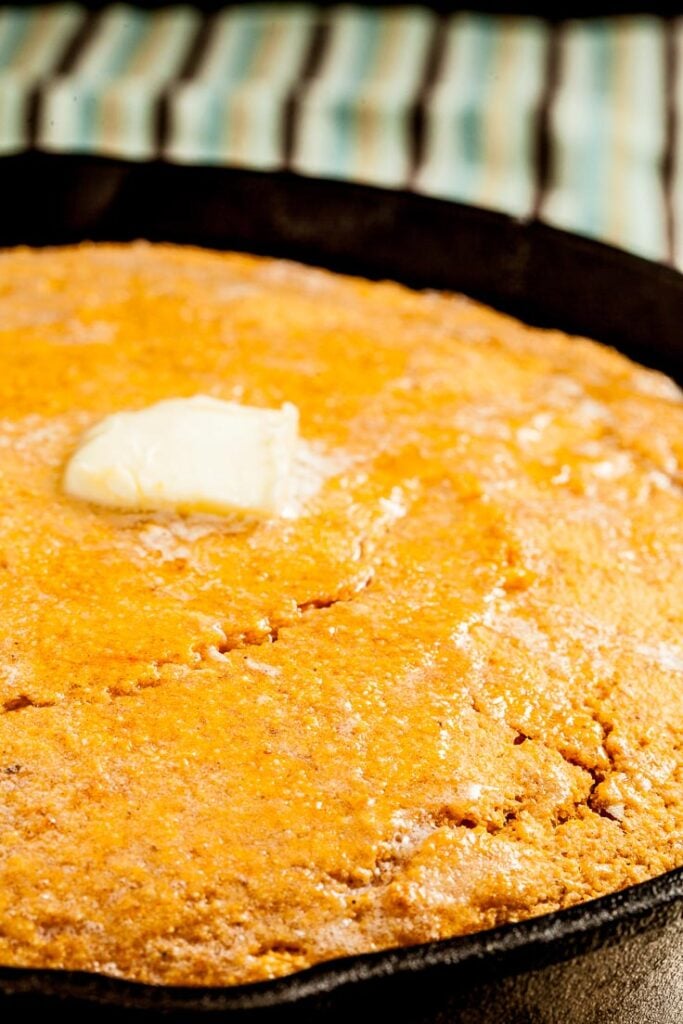 sweet potato cornbread with butter in skillet