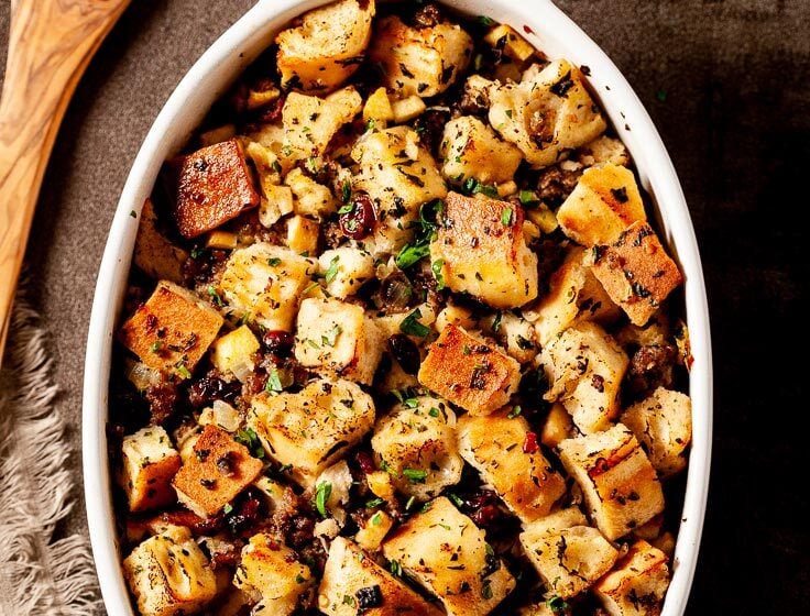 Homemade Stuffing with Sausage and Apples in White Dish