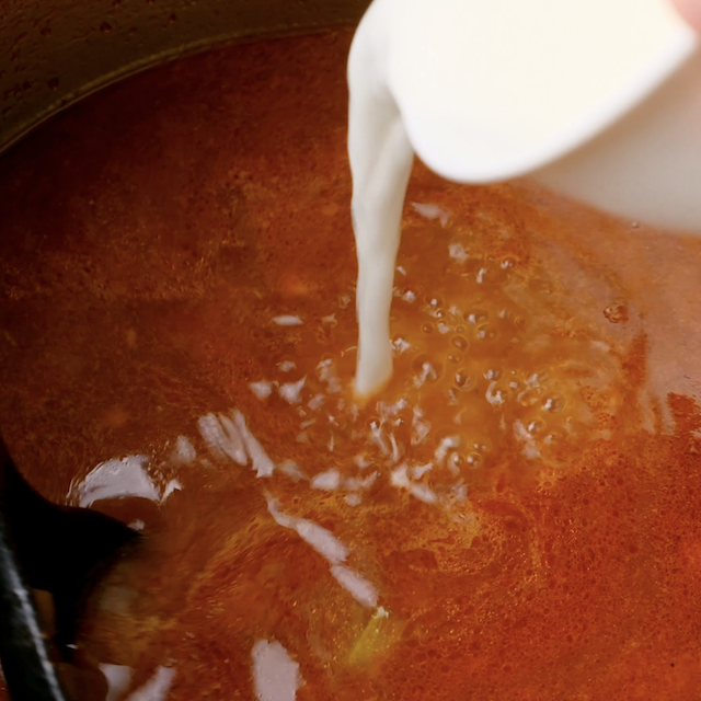 Cornflour slurry being added to thicken instant pot roast beef sauce.
