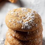 Brown Sugar Cookies stacked vertically on a marble countertop