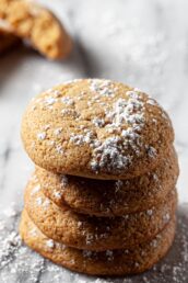 Brown Sugar Cookies stacked vertically on a marble countertop