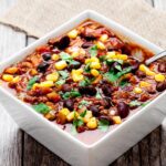 slow cooker chili in white bowl square