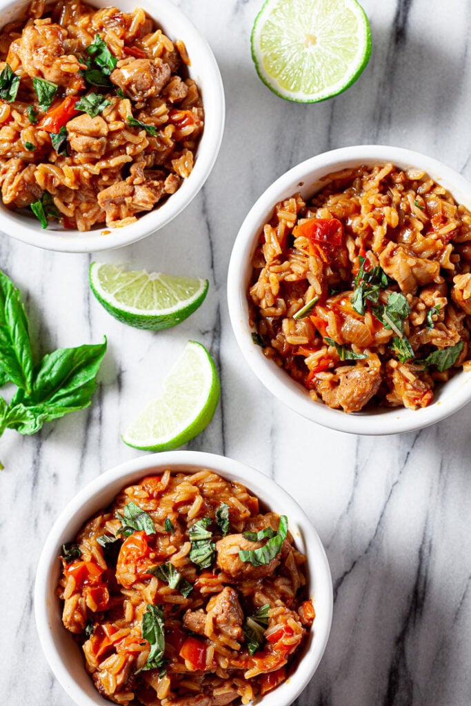 Thai chicken and rice in white bowls