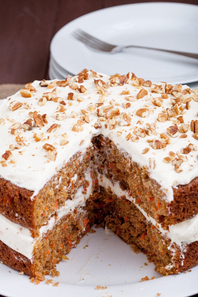 Carrot Cake with Cream Cheese Frosting with plates and fork