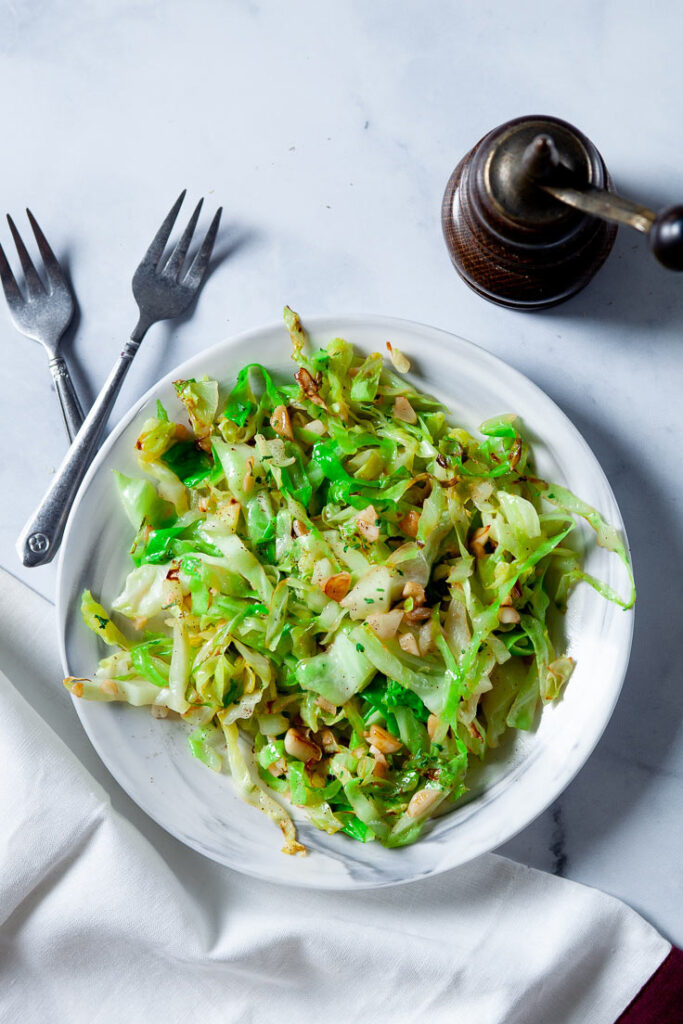 Sautéed Cabbage with garlic on white plate