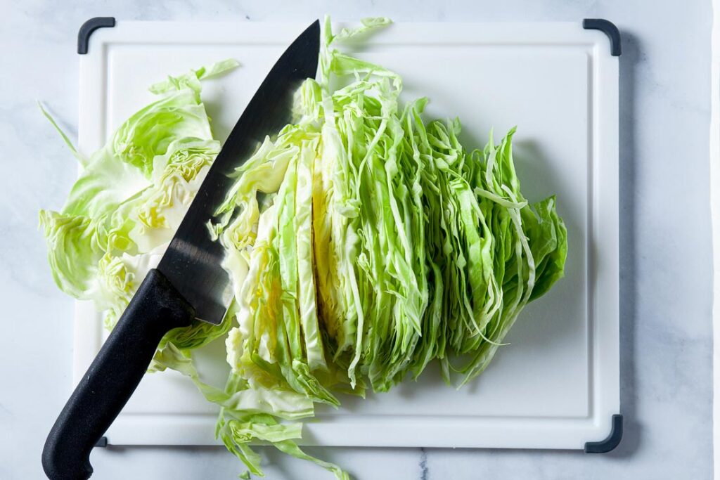 Slice cabbage thinly for stir fry