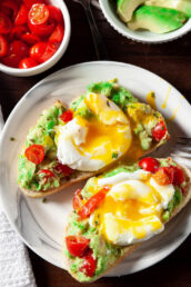 poached eggs on avocado toast on plate
