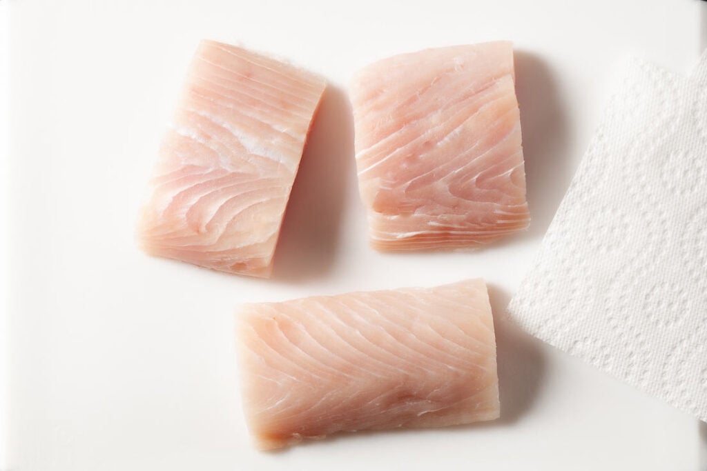 mahi mahi fillets on cutting board