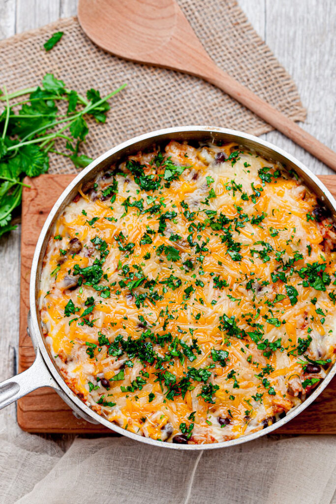 Chicken enchilada Casserole with rice and cheese in a pot