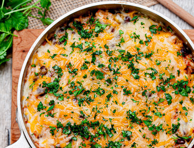 Chicken enchilada Casserole with rice and cheese in a pot