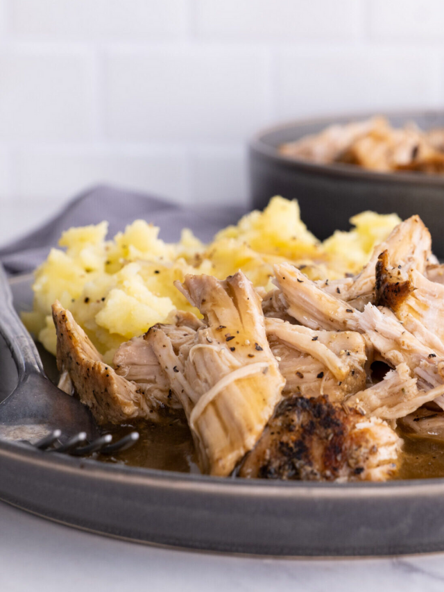 close up of slow cooker pork loin with gravy. 